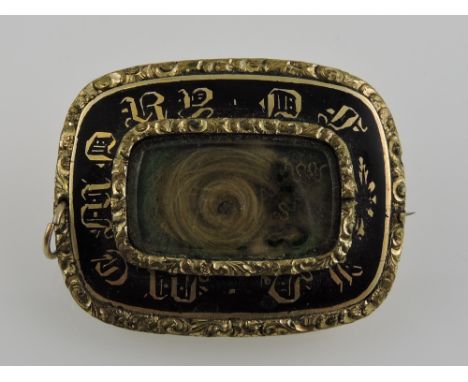 An early Victorian yellow metal memorial brooch, dated Nov 9th 1847, the central hair panel within a black enamel band letter