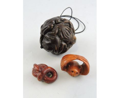 A hardwood carved netsuke in the form of a bat, together with another in the from of a snake and a carved inro, (3)