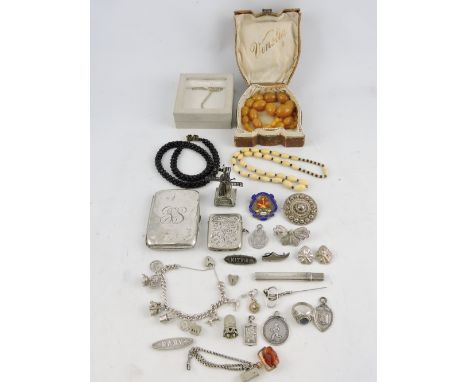 A small quantity of silver and white metal, including a cigarette case, vester case, various charms and sundry items, 9ozt, t