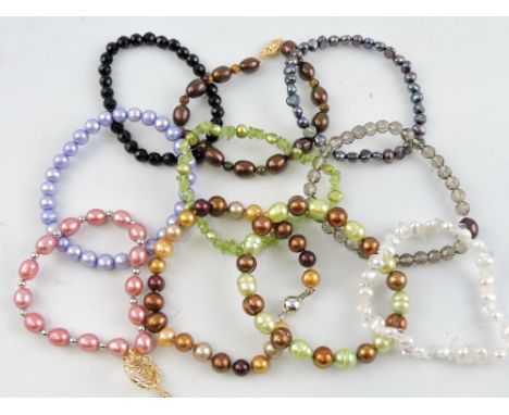 Ten assorted pearl and hardstone bracelets, some with white metal fittings marked 925.