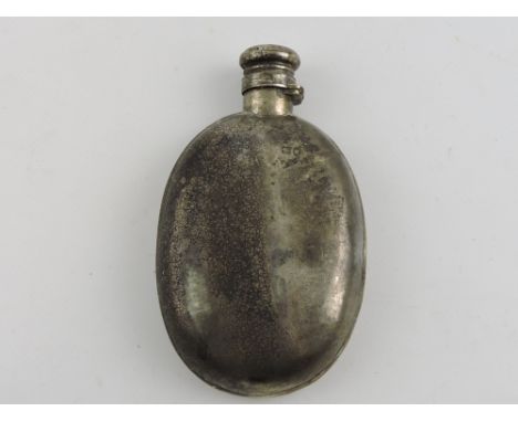 A Victorian silver spirit flask of oval form, London 1883.