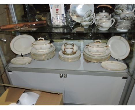 A Royal Worcester blanc de chine part dinner service with gilt edge and ownership initials, comprising two small oval lidded 