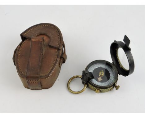 An early 20th Century lacquered brass dry card compass by Cary, London, mark VII with engraved mother of pearl dial and tan l