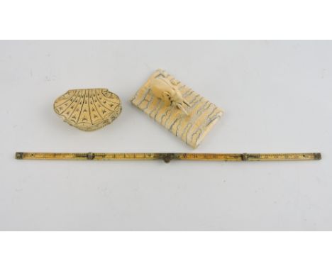 A 19th Century engraved bone snuff box modelled as a scallop shell, together with a Victorian bone folding rule and an elepha