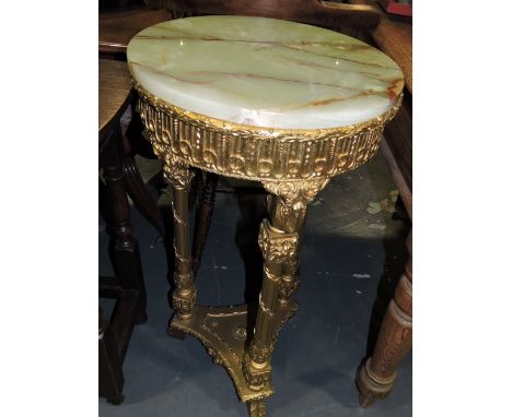 A gilt tripod table, with a green onyx top with a stock fluted frieze, turned reed legs joined by triangular undertier, W. 47