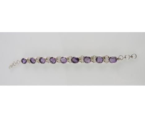 An amethyst bracelet, the nine stones set in white metal stamped 925.