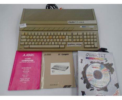 Atari ST 520 ST (upgraded to 1024K) with manual and and quartet music software. UK P&amp;P Group 2 (£20+VAT for the first lot