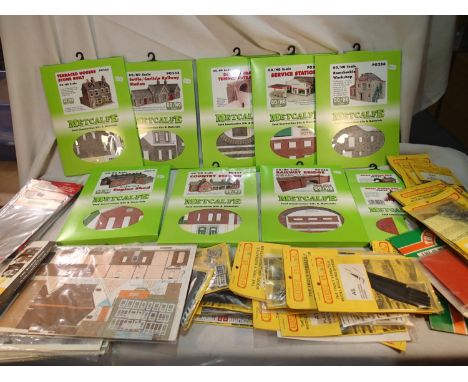 Ten Metcalfe OO scale building kits, sealed shop stock, plus a quantity of Linka accessories for plaster buildings and other 