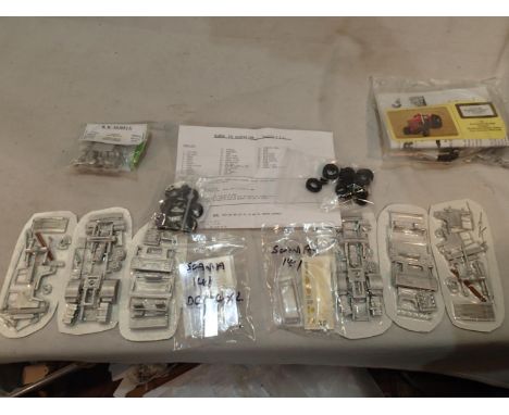 Four white metal kits, two Scania 141 tractor unit, Massey Ferguson tractor and Unimog tractor airfield support vehicle. UK P