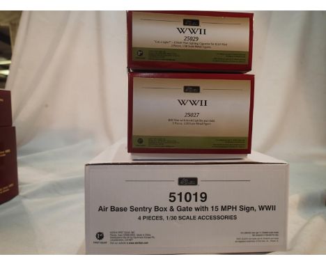 Three Britains WWII sets, 51019 air base sentry box, sign and gate, 25027 pilot with model Spitfire and child, and 25029 Got 