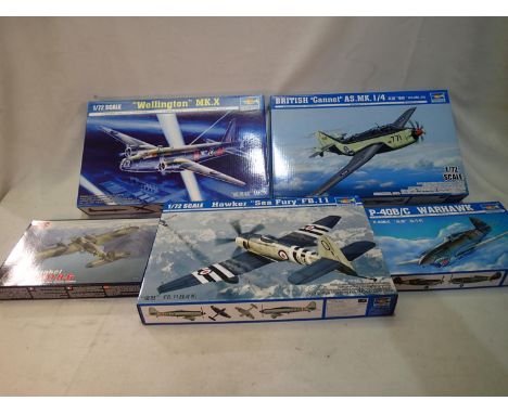 Four 1/72 scale aircraft kits, Trumpeter Wellington, Gannet, Warhawk and Sea Fury, and Roden Heinkel HEIII 1/144 scale, all a