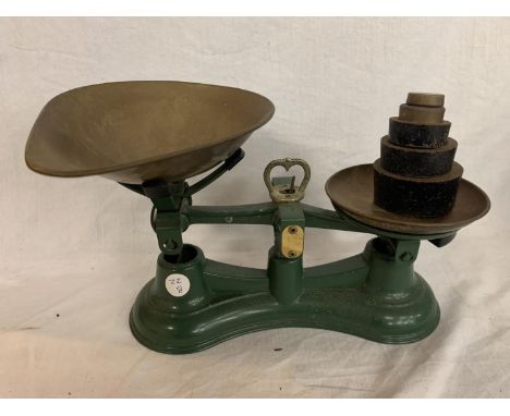 A GREEN SET OF SALTER SCALES WITH BRASS PANS AND WEIGHTS 