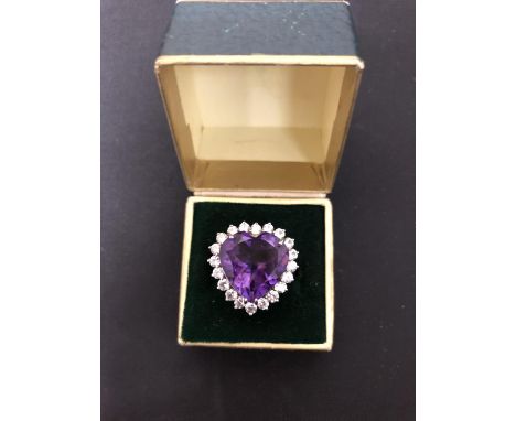 A SILVER MARKED LARGE HEART SHAPED AMETHYST AND PASTE STONE CLUSTER RING SIZE R.5 