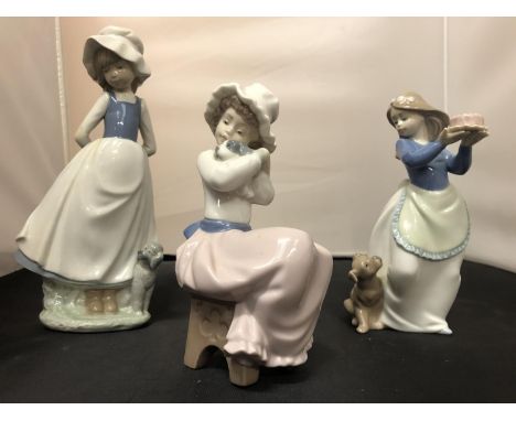 THREE NAO FEMALE FIGURINES WITH DOGS 