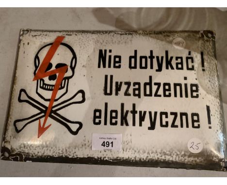 AN ENAMEL METAL SIGN 