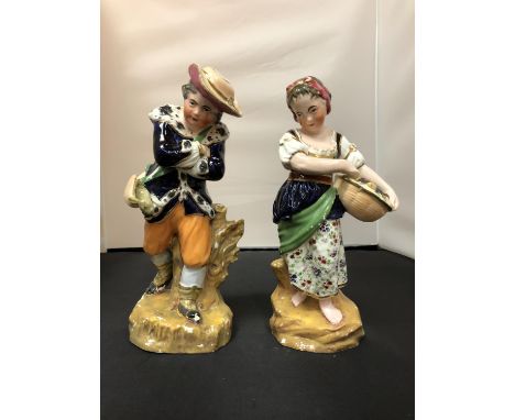 A PAIR OF CERAMIC FIGURINES 