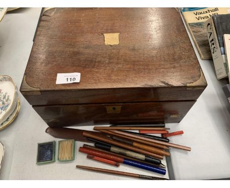 A MAHOGANY WRITING SLOPE WITH GLASS INKWELL AND FOUNTAIN PENS 