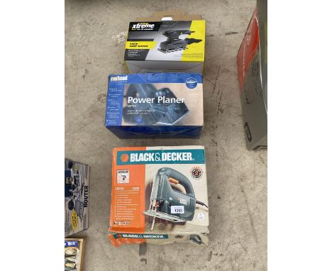 AN ELECTRIC PLANER, SANDER AND JIGSAW 