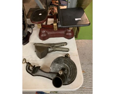 THREE VINTAGE ITEMS TO INCLUDE A SET OF SCALES, A POTATO PRESS AND A MARMALADE CUTTER 