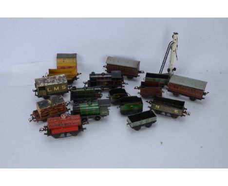 Hornby 0 Gauge post-war clockwork Locomotives Rolling Stock and Accessories, BR black Type 40 Tank Engine, and two BR green 4