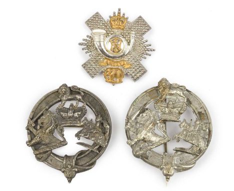 A post 1902 officer's gilt and silver-plated shako badge of the Highland Light Infantry, together with two clan badges, Fife 