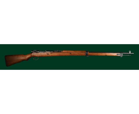  ƑToyo Kogyo: a 7.7mm Japanese 'Arisaka' bolt action service rifle, serial number 21894, barrel 31 in., ladder backsight with