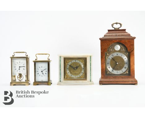 Elliott onyx and malachite clock, with a brass and silvered Roman dial, putti spandrels approx 17w x 14 h cms retailed by Leo