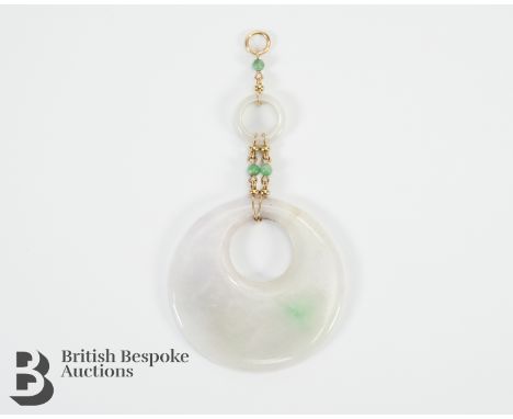Chinese white jade disc pendant suspended from a 9ct yellow gold drop and beads. The disc measuring 53 mm diameter.&nbsp;&nbs