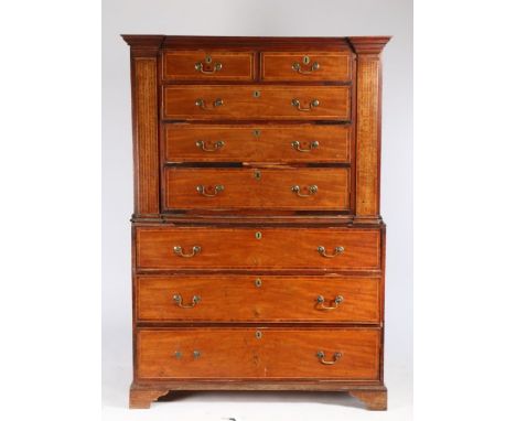 Unusual George III mahogany chest on chest, the concave cornice above two short and three long drawers flanked by box wood st