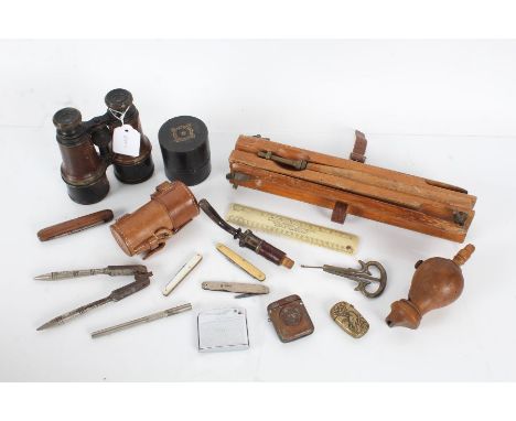 Mixed works of art, to include binoculars, pair of steel nutcrackers, cheroot holder, mother of pearl and yellow metal button