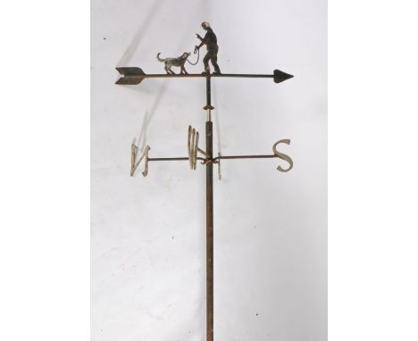 Metal weather vane, with a man with his dog, N.S.E.W. by blacksmith Graham Chaplin, 200cm long&nbsp;