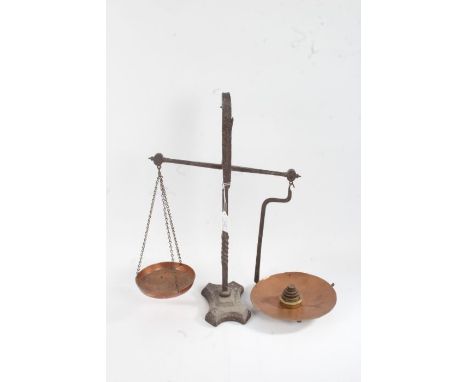 Pair of cast iron balance scales, with copper pans and small set of six brass weights
