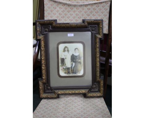 Victorian portrait on porcelain, painted with a young boy and girl, the boy dressed as a sailor, housed with a gilded and woo