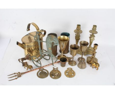 Quantity of various brass ware, to include watering can, shell cases, goblets, candlesticks, toasting fork etc., (qty)