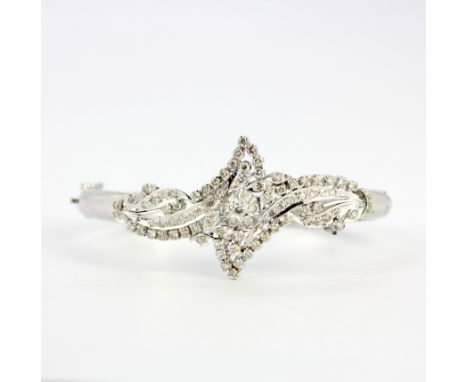 A white gold plated base metal bangle lavishly set with diamonds  (ideal for break up), diamond setting L. 4.5cm.