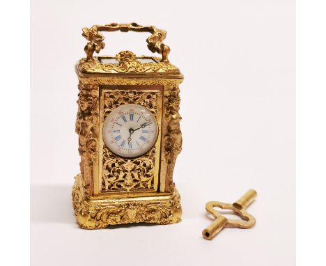 A miniature gilt brass carriage clock, H. 9cm.