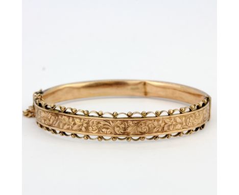 A hallmarked 9ct rose gold bangle, internal size 5.5 x 4.5cm. Some dents, approx. 8.3gr.&nbsp;