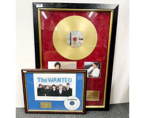 A framed Michael Jackson Thriller gold record with  plaque and pictures, and a further CD for the Wanted, largest frame size 
