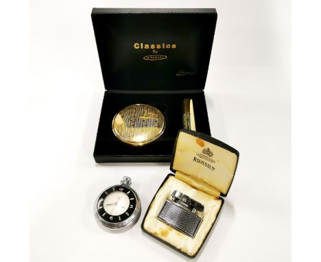 A vintage lighter, watch, compact and lipstick.