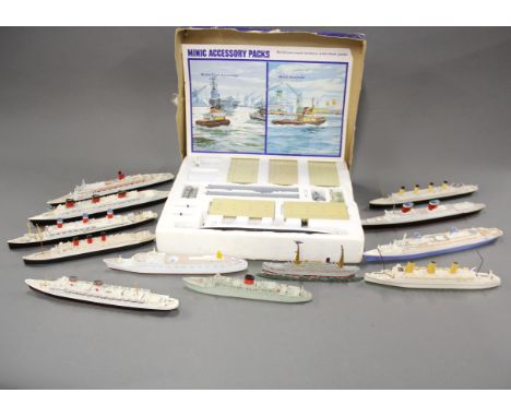 A Minic ship's ocean terminal with a collection of diecast model ships, longest L. 25cm.