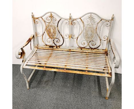 A two seater cast iron garden bench, L. 120cm H. 100cm.