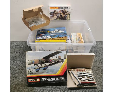 A box of mixed model kits.