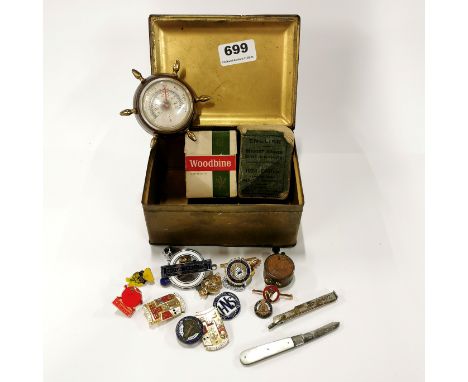 A small box of interesting items including a trench art lighter.