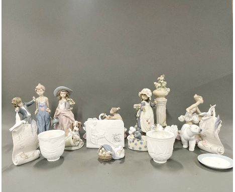 A large collection of Lladro, Nao and other porcelain figures, tallest H. 30cm.