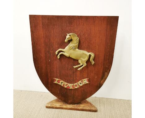 A wooden and brass firescreen, H. 63cm.