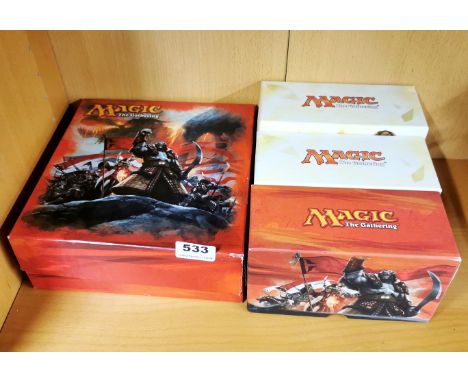 Three boxes of magic the gathering game cards.