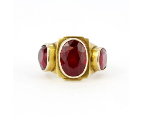 A gent's 14ct yellow gold (tested) ring set with large oval cut rubies, (R ).