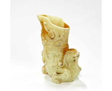 A large Chinese archaic form jade wine cup, H. 21cm.