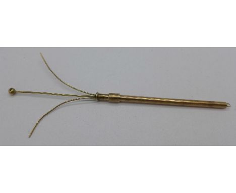 A 9ct gold swizzle stick, 3.4g