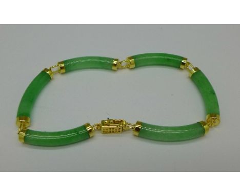 A silver mounted jade bracelet
